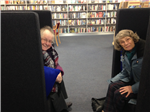 Friends, Liz Jack and Maureen Anderson testing aucoustic chairs